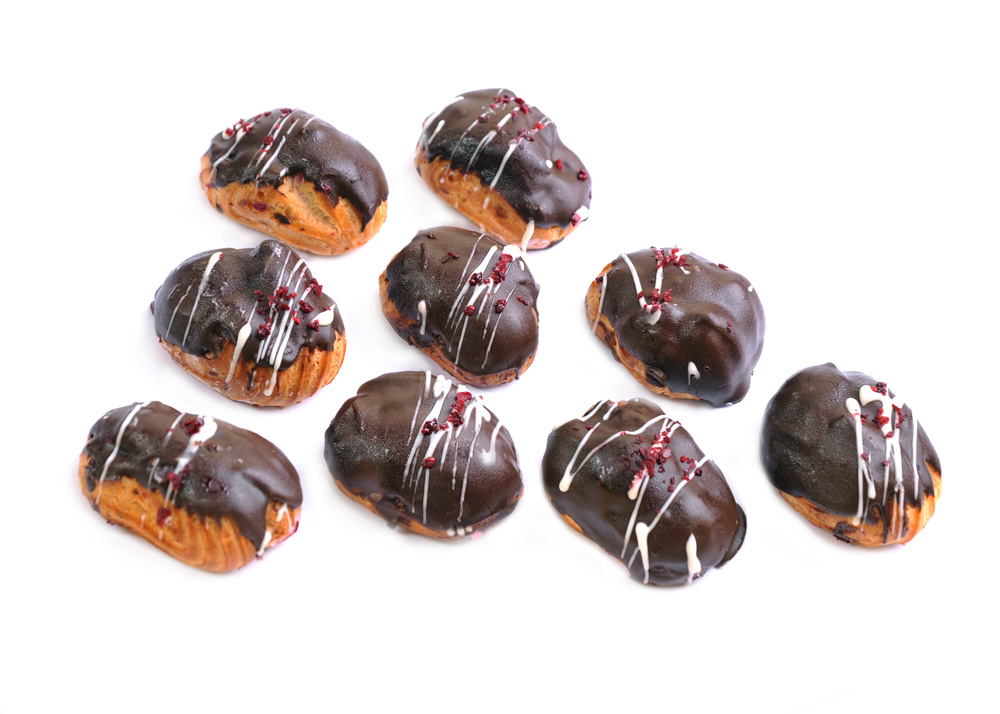 Mini Eclairs with berry filling in dark chocolate